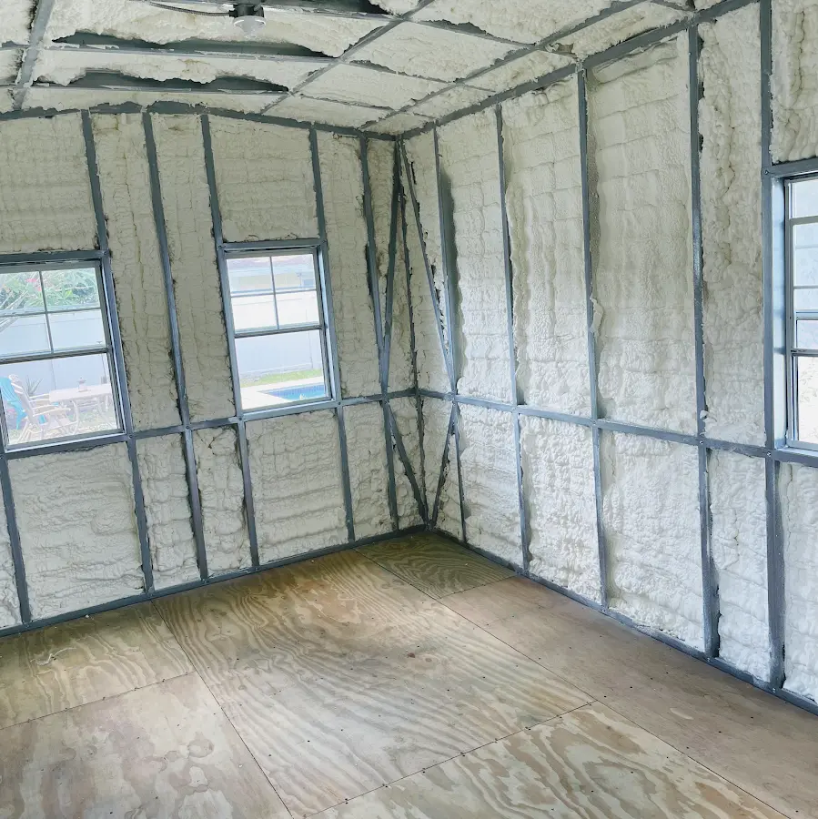 Closed-cell spray foam insulation applied to wall cavities in a residential project in Burnt Mills